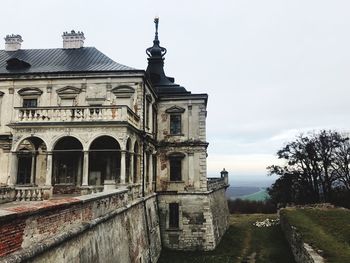 Low angle view of old building against sky