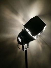 Low angle view of illuminated lamp against sky