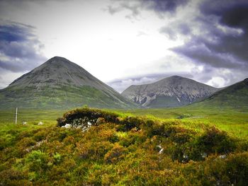 Scenic view of landscape and mountains against sky