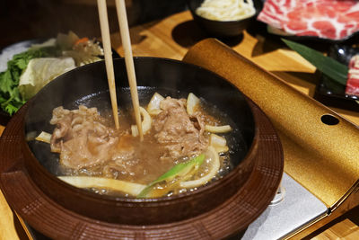 Beef and pork meat prepared for sukiyaki, japanese hot pot