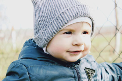 Close-up portrait of cute baby girl in winter