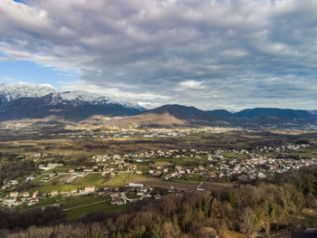 Aerial view of landscape and mountains against sky