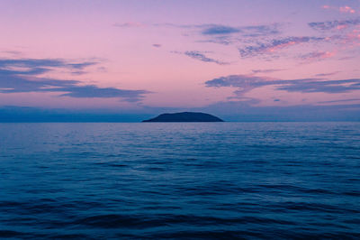 Scenic view of sea against sky at dusk