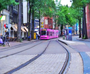 View of railroad tracks amidst buildings in city