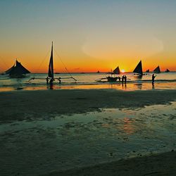 Silhouette of boat in sea