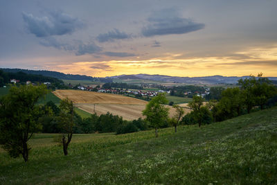 Scenic view of landscape against sky during sunset
