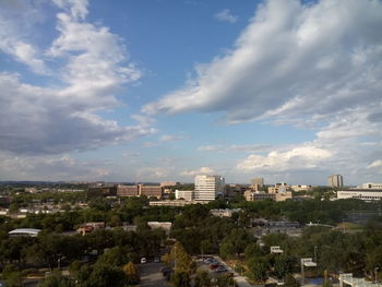 High angle view of buildings in city against sky