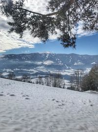 Scenic view of snowcapped mountains against sky
