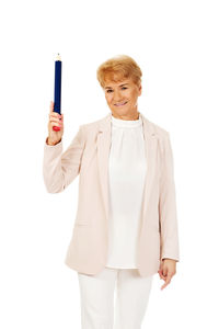 Portrait of teenage girl standing against white background