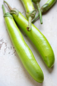 Close-up of green chili peppers on table