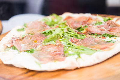 Close-up of pizza served on table