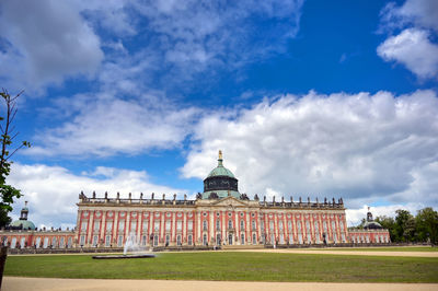 Building against cloudy sky