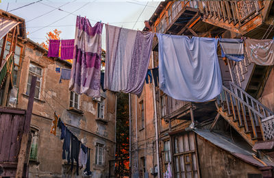 Low angle view of clothes drying outside house