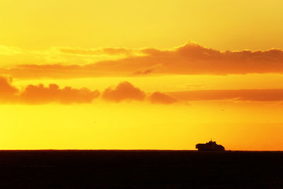 Scenic view of sea against sky at sunset