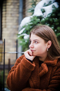 Portrait of young woman looking away