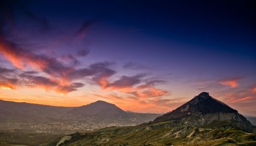 Scenic view of mountains at sunset