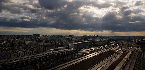 High angle view of railroad tracks amidst buildings in city