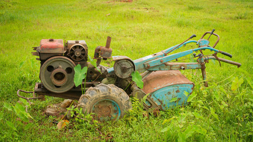 Old farm plow. closeup view of an old farm tractor plow and tire stock. old farm tractor plow.