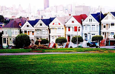 Houses in city against sky