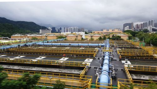 High angle view of city against cloudy sky