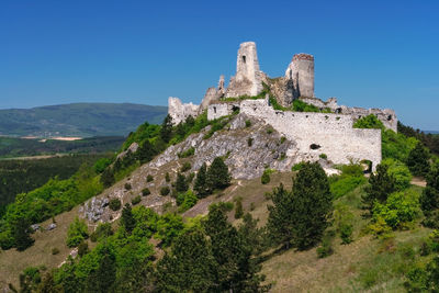 View of old ruin building against blue sky