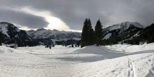 Panoramic view of landscape against sky during winter