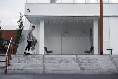 Man standing in front of building