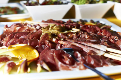 Close-up of meat served in plate on table