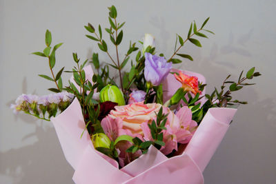 Close-up of pink flower pot on plant