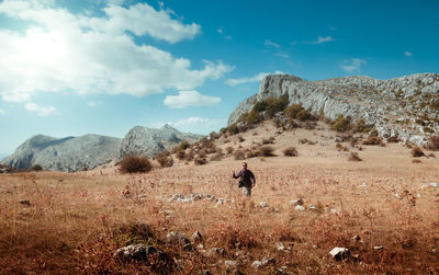 Man on field against sky