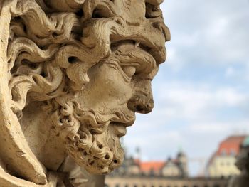 Close-up of statue against building