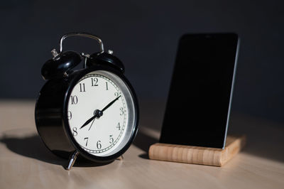 Close-up of clock on table