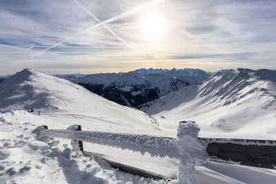Scenic view of snow covered mountains against sky