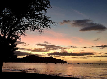 Scenic view of sea against orange sky