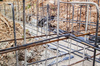 High angle view of rusty metal fence