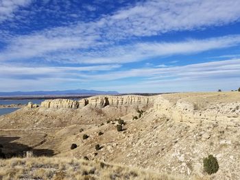 Panoramic view of landscape against blue sky