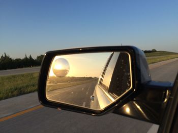 Reflection of car on road