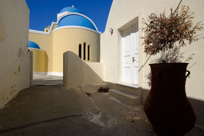 Entrance of temple against building