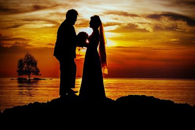 Silhouette people at sunset