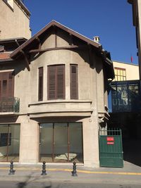 Street by building against clear sky