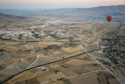 Aerial view of hot air balloon over city