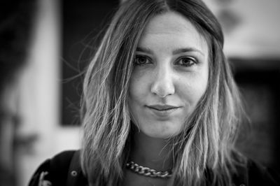 Close-up portrait of a smiling young woman