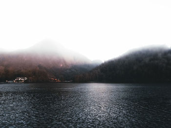 Scenic view of lake and mountains against sky