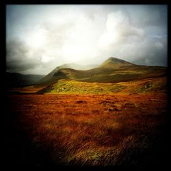 View of landscape against cloudy sky