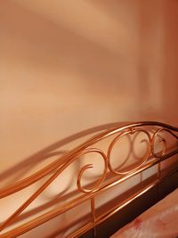 Close-up of bed against wall at home