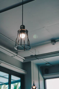 Low angle view of illuminated pendant light