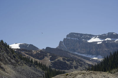 Scenic view of mountains against clear sky during winter