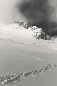 Scenic view of snowcapped mountain against sky