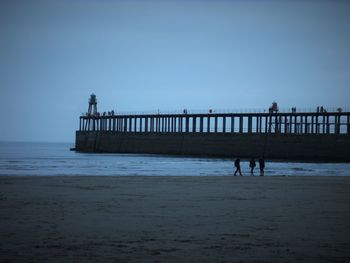 Pier on sea against sky