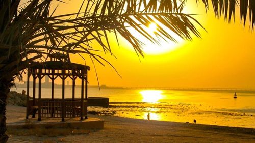 Scenic view of beach at sunset